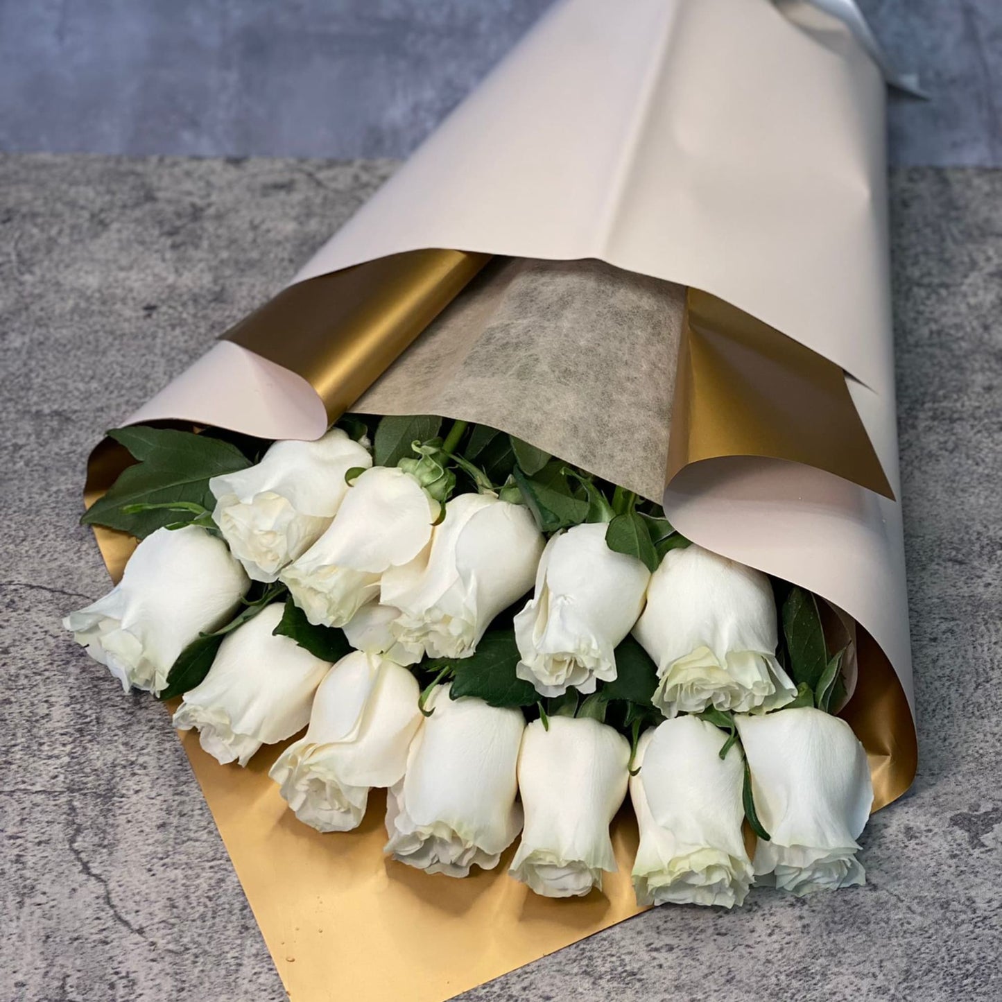 Dozen white roses